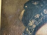 portrait of a man with a blue hat and a blue turban in a gold frame