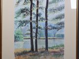 framed watercolor painting of trees by a lake in the woods