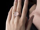 a woman with a ring on her finger and a ring on her hand