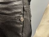 a close up of a pair of pants with buttons on them