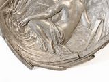 a silver plate with a picture of a child on it