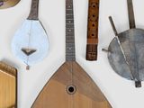 many different types of musical instruments displayed on a white surface