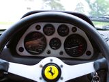 a steering wheel and gauges in a car