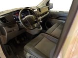a view of the inside of a vehicle from the driver ' s seat