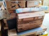many boxes stacked on top of each other in a warehouse