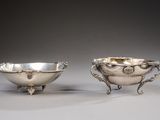 pair of silver plated bowls with handles and handles