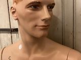 a male mannequin with no shirt on and no shirt on