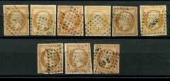 a group of stamps on display in a glass case