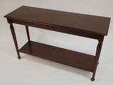 a small wooden table with a shelf underneath it