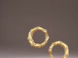 a pair of gold earrings with diamonds on them