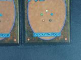 two cards with different designs on them on a table