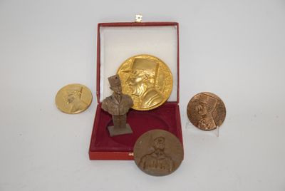 an image of a gold medal and other coins in a red box