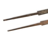 these are two old tools that are sitting on a white surface