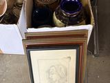 a box full of vases sitting on the floor