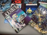 a lot of comic books sitting on a table