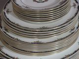 a lot of plates and bowls stacked on top of each other