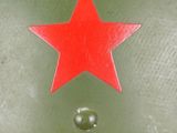 an army helmet with a red star on the side of it