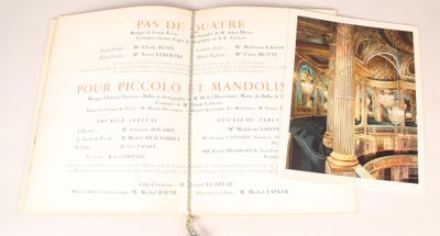 an open book with a picture of a room in it