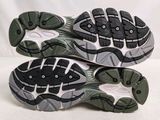 the soles of a pair of running shoes on a white background