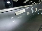 a close up of a car door with a sticker on it