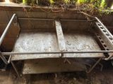 a metal table that has been placed on the ground