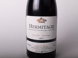 a bottle of wine that is sitting on a table