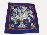 blue and white floral print scarf with red border