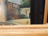 a picture of a painting of a house on a shelf