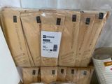 a lot of boxes of toilet paper sitting on a shelf