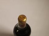 a bottle of wine that is sitting on a table