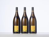 three bottles of wine sitting next to each other on a table