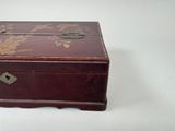 a small wooden box with a floral design on it