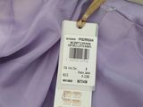 the label on a purple shirt is attached to a hanger