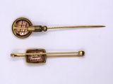 pair of antique brass hair pins with a penny on them