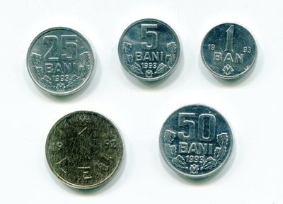 four different types of coins are shown on a white surface