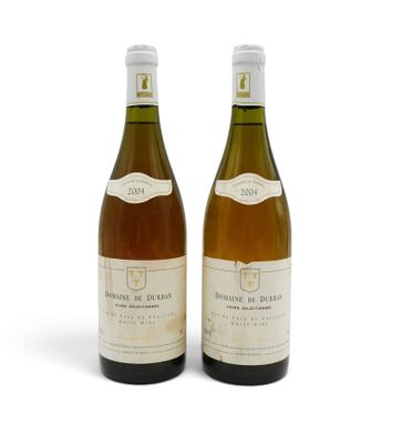 two bottles of wine sitting next to each other on a white surface