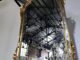 a mirror hanging on the wall in a room