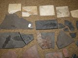 several pieces of stone are laid out on the floor