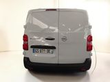 a white van that is plugged into a wall