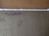 two pieces of brown paper with writing on them