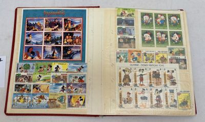 an open book on a table with pictures of cartoon characters on it