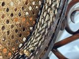 a wicker chair that has holes in it