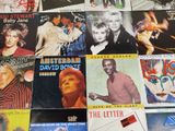 a lot of different album covers on a table