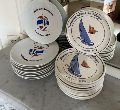 a lot of plates that are sitting on a counter