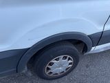 a white van that is parked in a parking lot