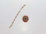 a small piece of metal with a chain on it