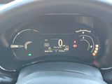 the dashboard of a car with a digital display on it