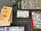 a lot of stamps and other items on the table