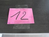 a pink sticker with the number 12 on it