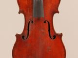 an old violin with a bow hanging from it ' s back
